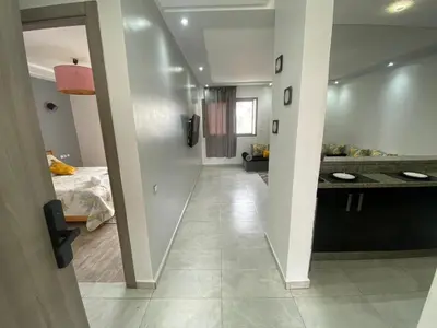 a hallway leading to a kitchen and a bedroom at Marbella beach appart de standing in Mansouria