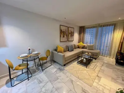 a living room with a couch and a table at Studio Haven in the Old Medina in Casablanca