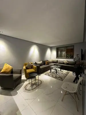 a living room with a couch and a table at Appartement propre 2 Chambres in Casablanca