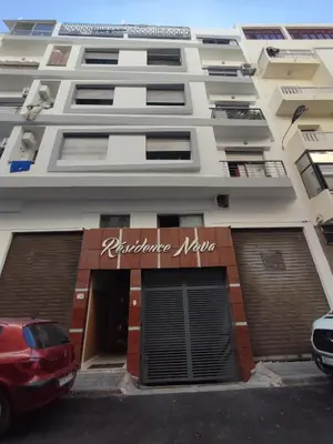 a building with a car parked in front of it at Appartement propre 2 Chambres in Casablanca
