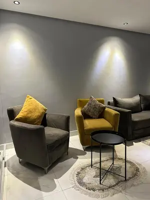a living room with two couches and a table at Appartement propre 2 Chambres in Casablanca