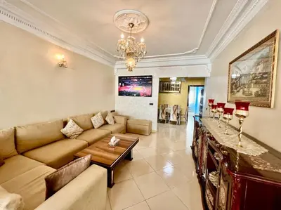 a living room with a couch and a table at CASA Ghandi Central Apart 1Ch salon in Casablanca