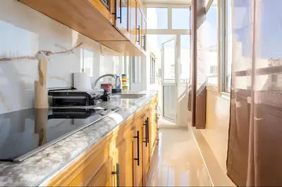 a kitchen with a sink and a counter top at Spacieux appartement 80 m² - Centre de Casablanca in Casablanca