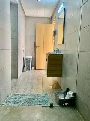 a bathroom with a sink and a mirror at Cosy 80 m2 with 2 balcony 5min Hassan 2 in Casablanca