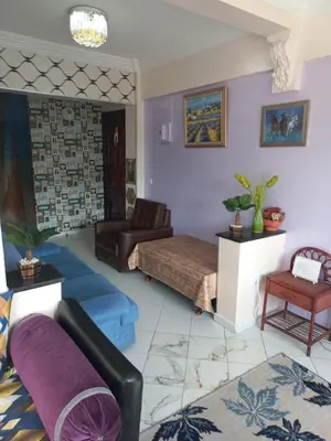 a living room with a bed and a couch at Appartement moderne vue sur mer in Casablanca