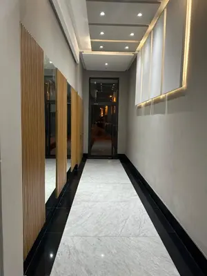 an empty hallway with a white floor in a building at Studio anfa plaza in Casablanca