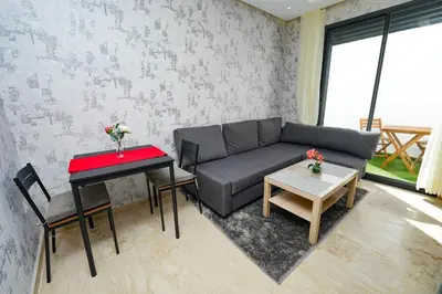 a living room with a couch and a table at Studio anfa plaza in Casablanca