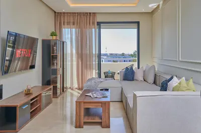 a living room with a couch and a table at YourPlace Rabat - Royal Residence in Rabat