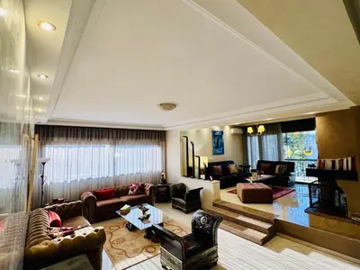 a large living room with couches and a table at Rabat Agdal Pearl - 2BR Spacious & Well located in Rabat
