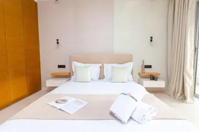 a bedroom with a bed with two towels on it at Aristocratic Abode: Luxurious 2BR Flat in Agdal in Rabat