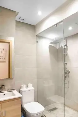 a bathroom with a shower and a toilet and a sink at BeachSide marvel in Casablanca