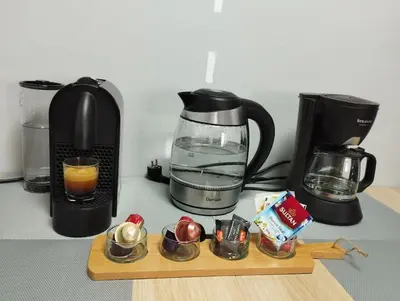 a kitchen counter with a coffee maker and a blender at Mohammedia Relax in Mohammedia