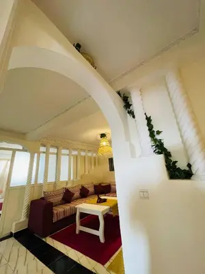 a living room with a couch and a table at Coquet Appartement Casablanca in Casablanca