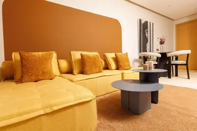 a living room with a couch and a table at Stylish 1BR flat in Hay Riad Central Rabat in Rabat