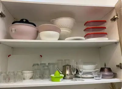 a shelf full of dishes and bowls and plates at Lovely Studio in the city centre with WIFI. in Casablanca
