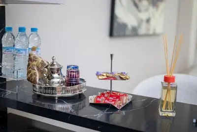 a black table with bottles of water and snacks at Studio chic avec parking in Casablanca