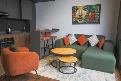 a living room with a couch and a table at Résidence Galilée - Gauthier in Casablanca