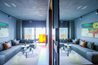 a living room with couches and tables at Résidence Galilée - Gauthier in Casablanca