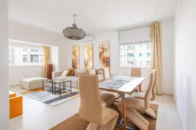 a living room with a table and a couch at Charming apartment, in heart of Agdal, 2 rooms in Rabat