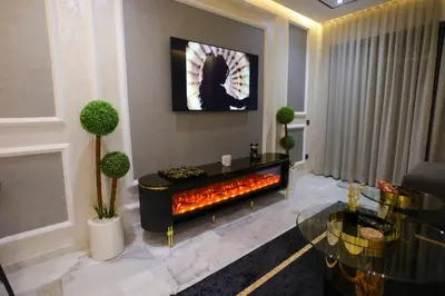 a living room with a fire place in the middle at Modern Cozy Ghandi District in Casablanca