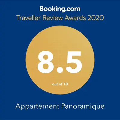 a yellow circle with the number eight and the text travelling review awards at Appartement Panoramique in Casablanca