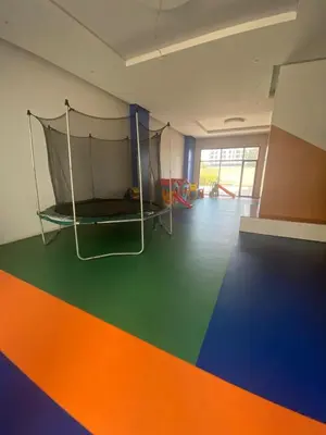an empty room with a trampoline on the floor at prestigieuse à casa finance city in Casablanca