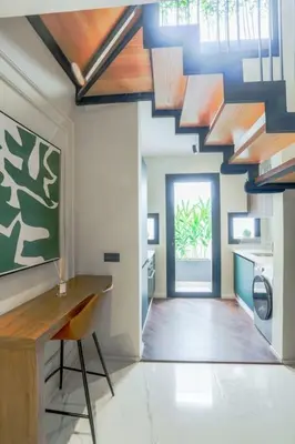 a kitchen with a table and a ceiling with skylights at Résidence Jade in Casablanca