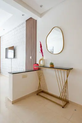 a dressing table with a mirror in a room at New Luxurious apartment Agdal Rabat center in Rabat