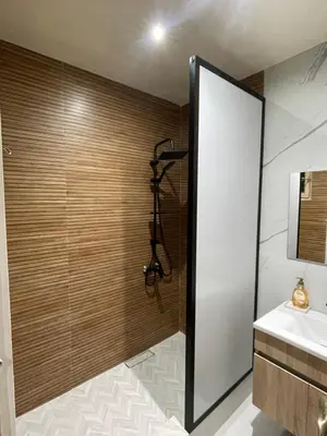 a bathroom with a shower and a sink at Appartement Cosy Agdal Centre Rabat in Rabat