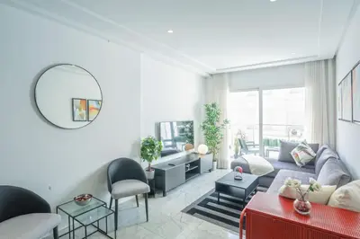 a living room with a couch and a table at Résidence Windsor in Casablanca