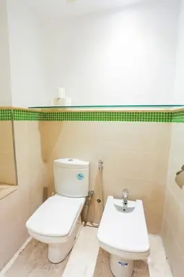 a bathroom with a toilet and a sink at Résidence Smalto - Bd Anfa in Casablanca