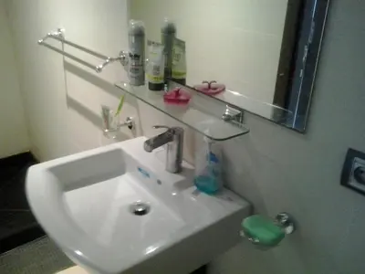 a bathroom with a sink and a mirror at Appartement Bella Vista in Bouznika