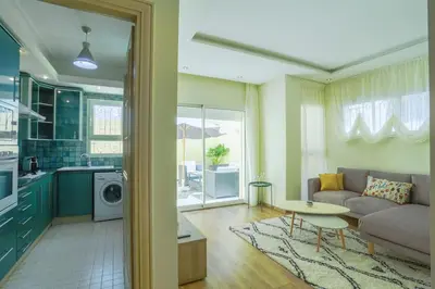 a living room with a couch and a table at Résidence Doribel in Casablanca
