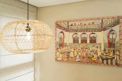 a tapestry hanging on a wall next to a lamp at Résidence de Nice in Casablanca