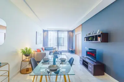 a living room with a table and a couch at #23 New Charming Casablanca Retreat/keyless door in Casablanca