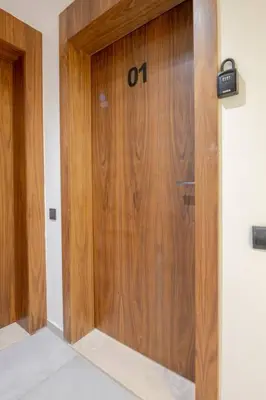 a wooden door with the number on it in a room at 1 Bedroom with Terrace Casablanca City Center in Casablanca
