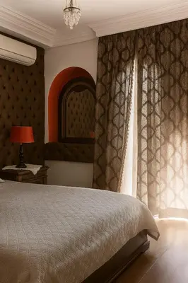 a bedroom with a bed and a window at Luxury duplex in the centre of Maarif in Casablanca