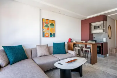 a living room with a couch and a table at Tribeca 3 - Casablanca Center in Casablanca