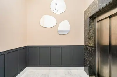 a lobby with three mirrors on the wall at Tribeca 3 - Casablanca Center in Casablanca