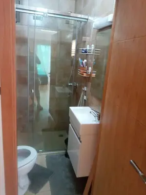 a bathroom with a shower and a toilet and a sink at Cocon cozy à Mansouria Mer, piscines et nature in Mansouria