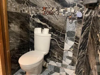 a bathroom with a toilet and a shower at Appartement oulfa in Casablanca