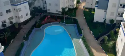 an overhead view of a swimming pool in a apartment at Sublime Appart Bouznika Pool&View in Bouznika