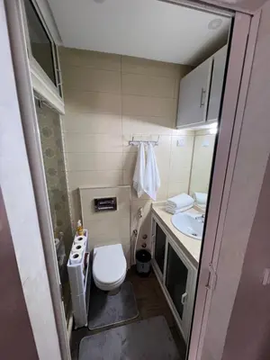 a small bathroom with a toilet and a sink at Appartement Dar Bouazza Tamaris Casablanca Airport AquaParc Fibre Orange Wifi Parking Security in Dar Bouazza