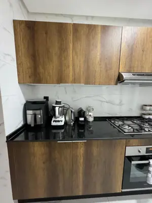 a kitchen with a stove and a counter top at ZS house harhoura vue sur piscine in Temara
