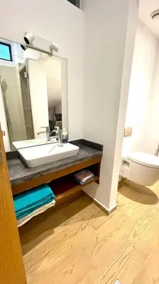 a bathroom with a sink and a toilet at Villa Havre De Paix à Casablanca in Casablanca
