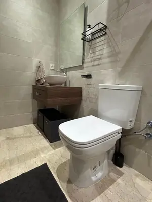 a bathroom with a white toilet and a sink at Studio cosy chic in Casablanca