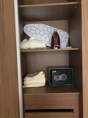 a closet with a tv and towels in it at Studio cosy chic in Casablanca
