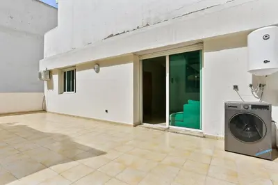 a washing machine sitting in the middle of a room at Serene One Bed Oasis in the Heart Of The Medina in Les Camps