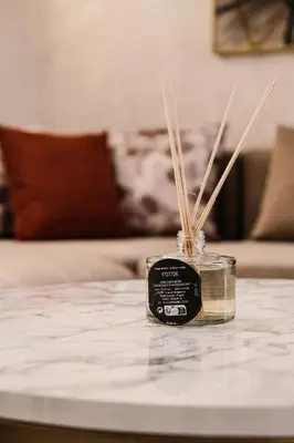 a jar with straws in it on a table at New Apartment Casablanca City Center Maarif in Casablanca