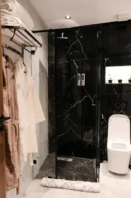 a bathroom with a shower with a toilet in it at New Apartment Casablanca City Center Maarif in Casablanca